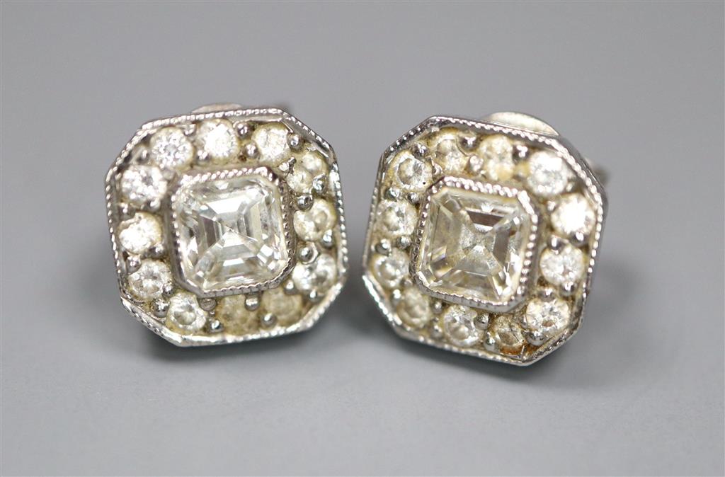 A pair of 750 white metal and octagonal diamond cluster ear studs, with asscher? cut central stones, 8mm, gross 2.7 grams.